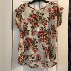 Cute floral with a zipper front!